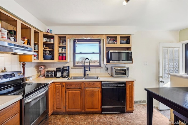 kitchen featuring backsplash, sink, extractor fan, and appliances with stainless steel finishes