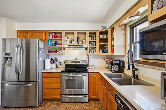 kitchen featuring decorative backsplash, extractor fan, sink, and appliances with stainless steel finishes