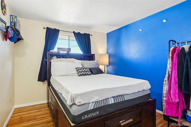 bedroom featuring hardwood / wood-style floors