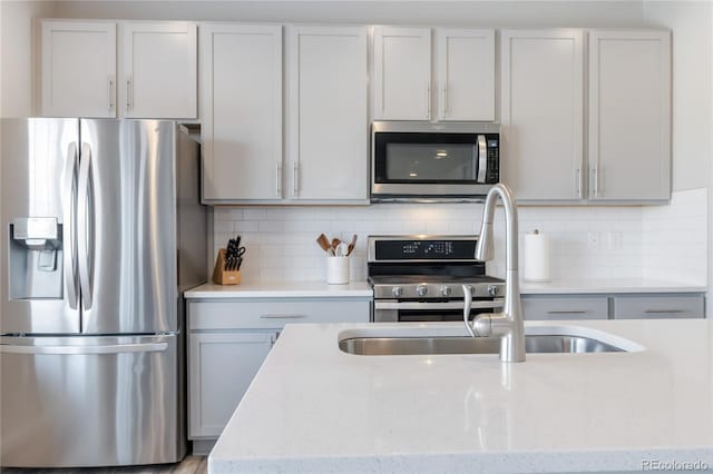 kitchen featuring backsplash and stainless steel appliances