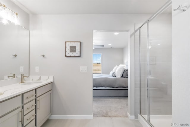 full bath featuring double vanity, a stall shower, ensuite bathroom, and a sink