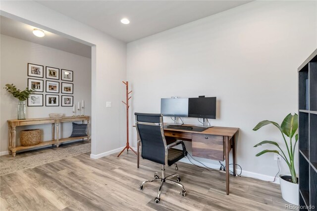 office featuring recessed lighting, baseboards, and wood finished floors