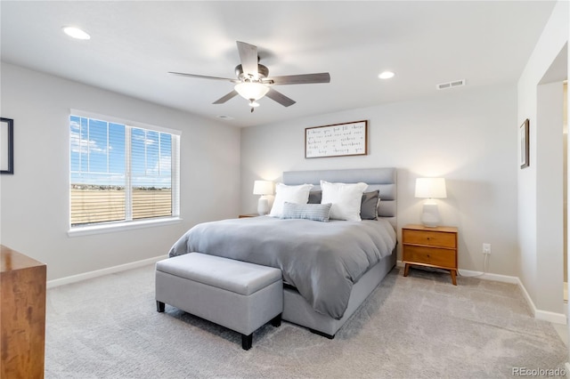 bedroom with recessed lighting, visible vents, light carpet, and baseboards