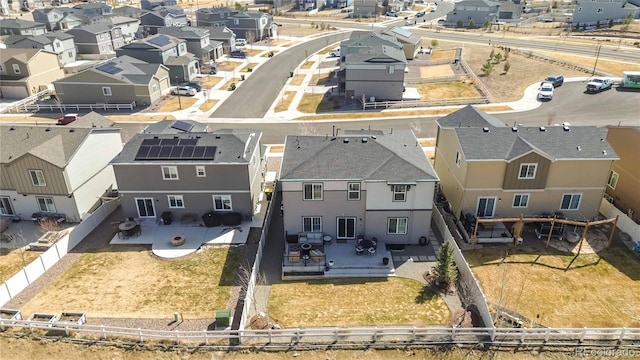 birds eye view of property with a residential view