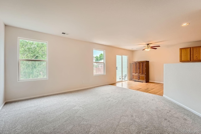 5522 S Quemoy Cir, Aurora, CO 80015 - unfurnished room with light colored carpet, plenty of natural light, and a ceiling fan