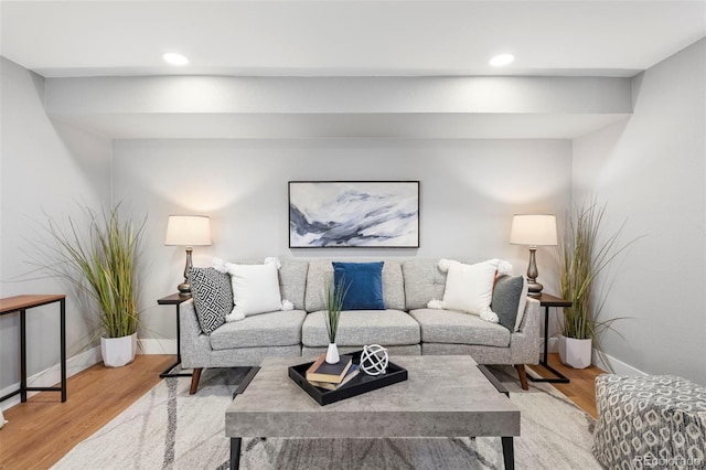 living area featuring baseboards, recessed lighting, and wood finished floors