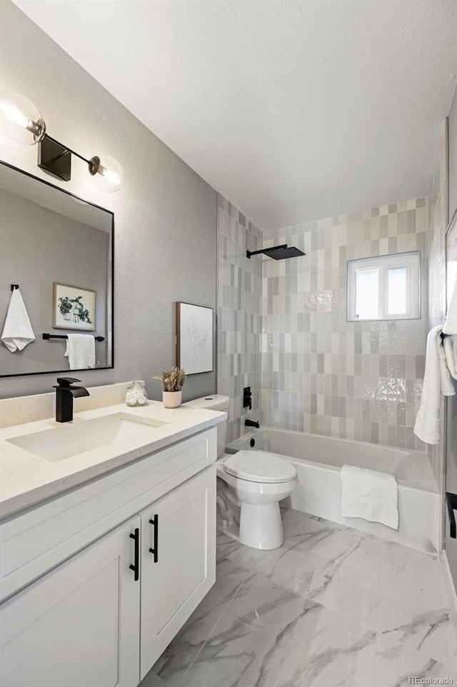 full bathroom featuring vanity, toilet, shower / tub combination, and marble finish floor