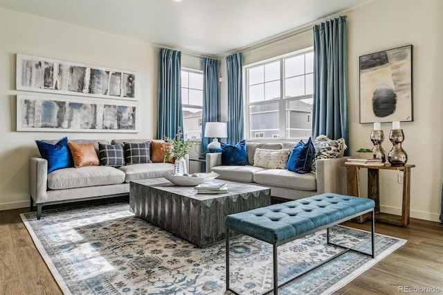 living room with wood finished floors and baseboards