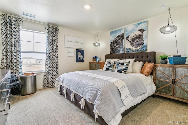 carpeted bedroom with visible vents