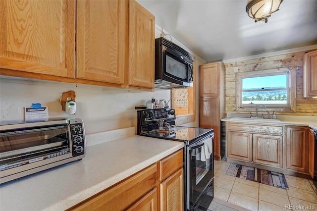 kitchen featuring light tile patterned floors, black / electric stove, and sink