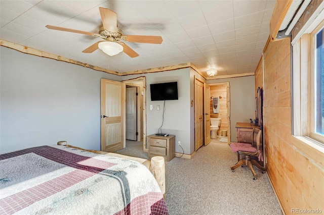 carpeted bedroom featuring ceiling fan and connected bathroom