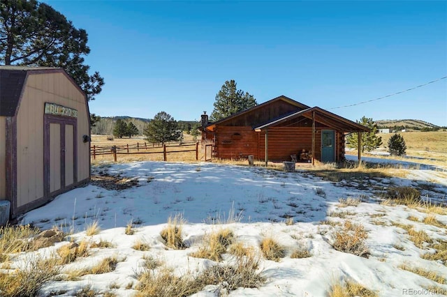 exterior space with a storage shed