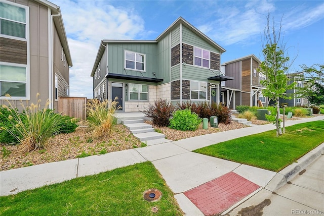 847 Great Plains Ave, Berthoud, CO 80513 - modern home with stone siding and board and batten siding