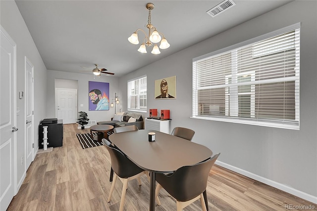 847 Great Plains Ave, Berthoud, CO 80513 - dining area with light wood-style floors, a chandelier, and a ceiling fan