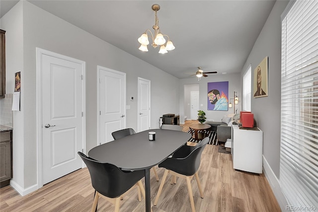 847 Great Plains Ave, Berthoud, CO 80513 - dining space featuring light wood-type flooring, a chandelier, and a ceiling fan