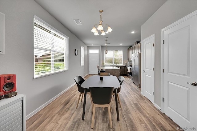 847 Great Plains Ave, Berthoud, CO 80513 - dining area featuring a chandelier, light wood-style floors, and recessed lighting
