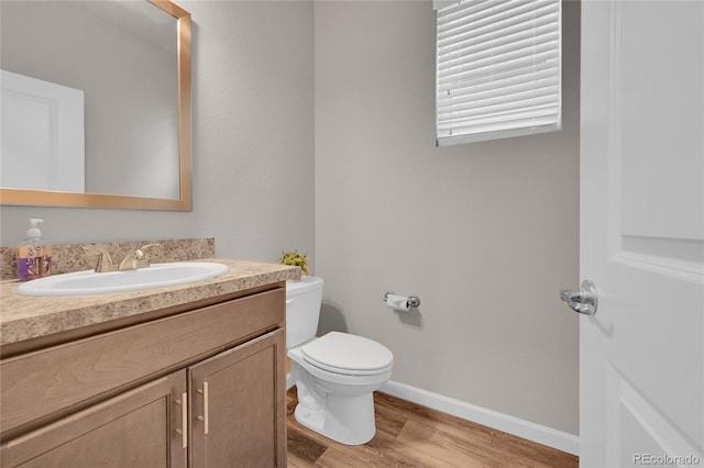 847 Great Plains Ave, Berthoud, CO 80513 - half bath featuring vanity and wood finished floors