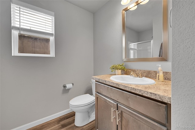 847 Great Plains Ave, Berthoud, CO 80513 - bathroom with vanity, wood finished floors, and an enclosed shower