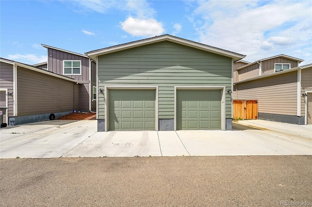 847 Great Plains Ave, Berthoud, CO 80513 - view of front of house featuring a garage, concrete driveway, and board and batten siding