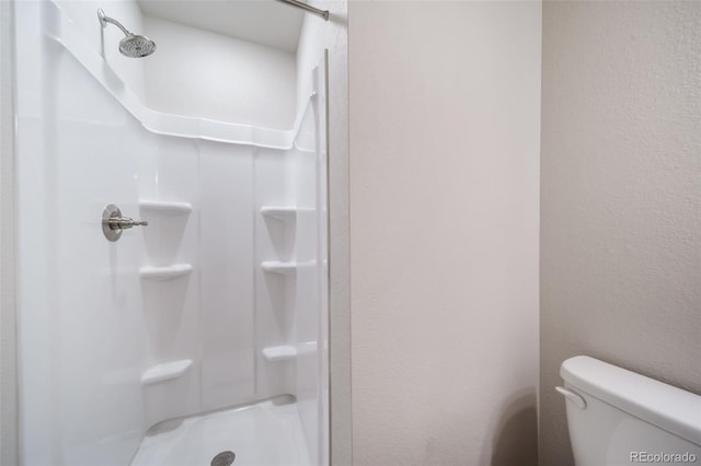 46558 Avery Ln, Bennett, CO 80102 - full bath featuring toilet and a stall shower