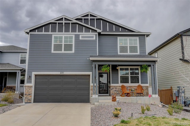 635 Silver Rock Trl, Castle Rock, CO 80104 - craftsman-style house with a porch, stone siding, driveway, and an attached garage