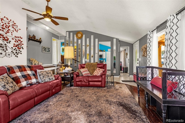 2115 Rangeview Dr, Pueblo, CO 81008 - living area with vaulted ceiling, ceiling fan, wood finished floors, and a textured ceiling