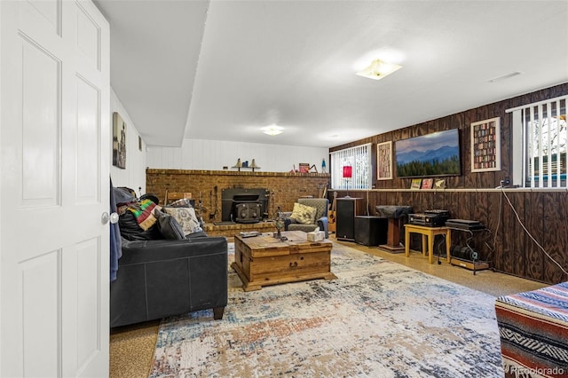 2115 Rangeview Dr, Pueblo, CO 81008 - living room featuring plenty of natural light, wood walls, and a wood stove