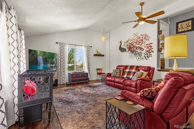2115 Rangeview Dr, Pueblo, CO 81008 - living room featuring a ceiling fan, wood finished floors, lofted ceiling, and a textured ceiling