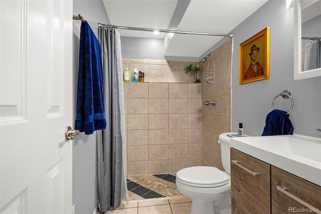 2115 Rangeview Dr, Pueblo, CO 81008 - full bathroom featuring vanity, toilet, tiled shower, and tile patterned floors