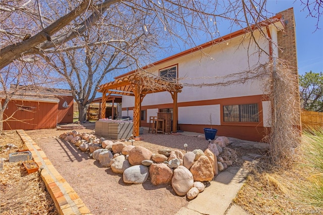 2115 Rangeview Dr, Pueblo, CO 81008 - rear view of property featuring stucco siding