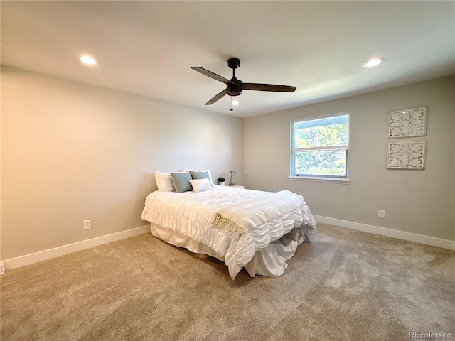 carpeted bedroom with ceiling fan