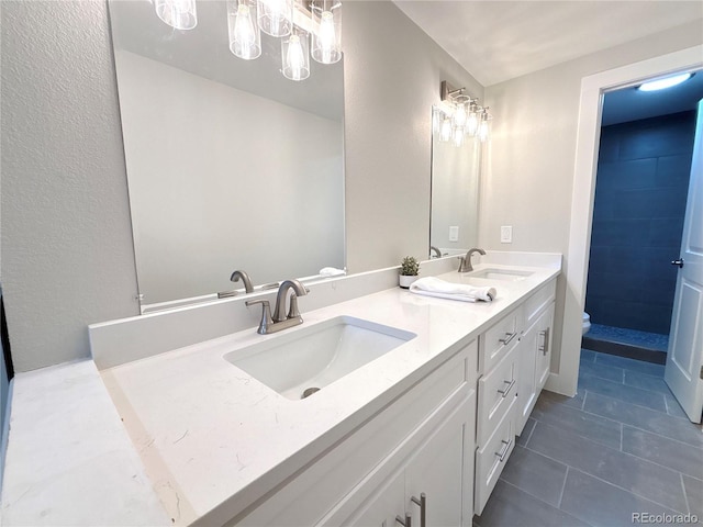 bathroom featuring vanity, tile patterned floors, and toilet