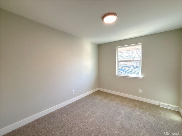 empty room with carpet flooring