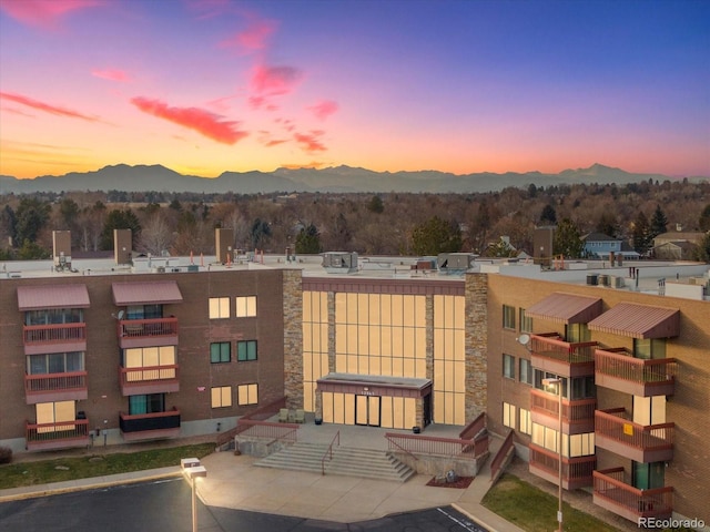 outdoor building at dusk with a mountain view