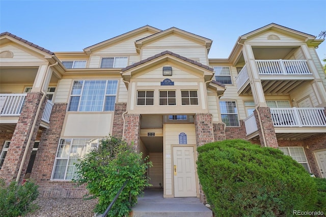 5726 N Genoa Way Unit 301, Aurora, CO 80019 - view of front facade featuring brick siding