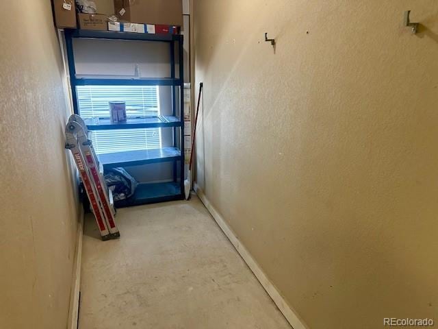 5726 N Genoa Way Unit 301, Aurora, CO 80019 - garage featuring baseboards
