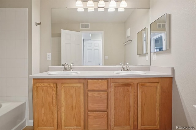 5726 N Genoa Way Unit 301, Aurora, CO 80019 - full bathroom featuring double vanity and washtub / shower combination