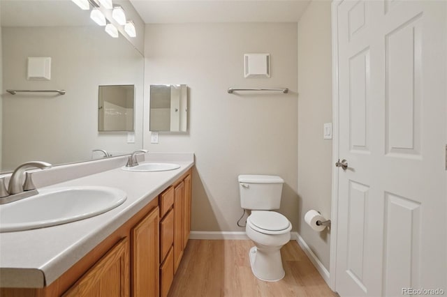 5726 N Genoa Way Unit 301, Aurora, CO 80019 - full bath featuring double vanity and wood finished floors