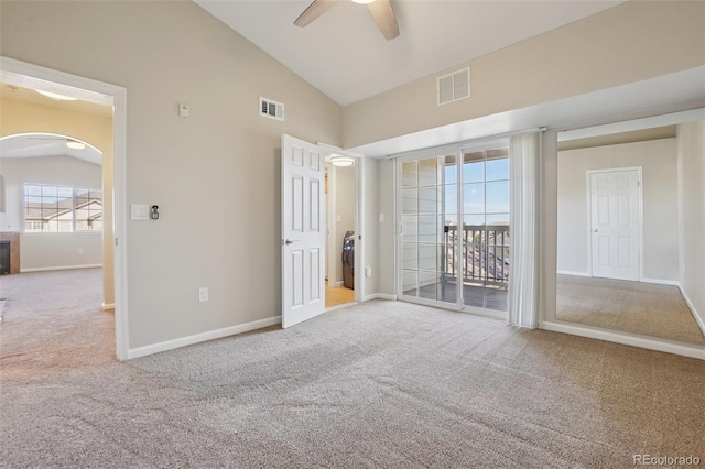 5726 N Genoa Way Unit 301, Aurora, CO 80019 - unfurnished bedroom with carpet flooring, arched walkways, access to outside, ceiling fan, and high vaulted ceiling