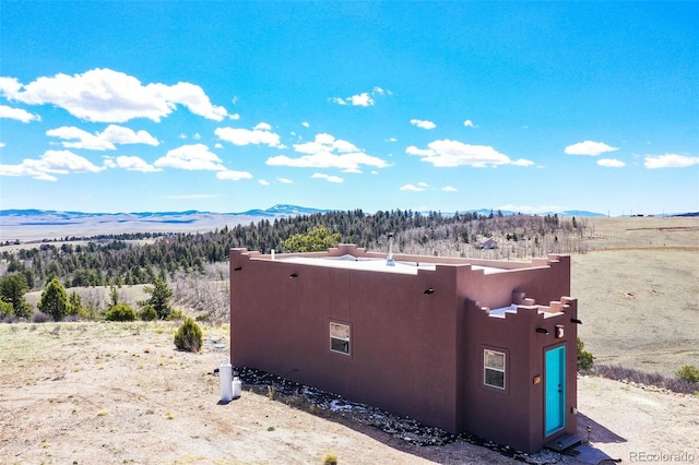 exterior space featuring a mountain view