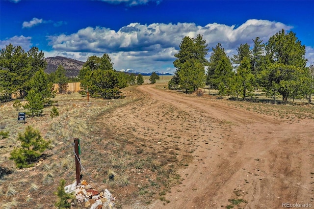 view of street featuring a mountain view and a rural view