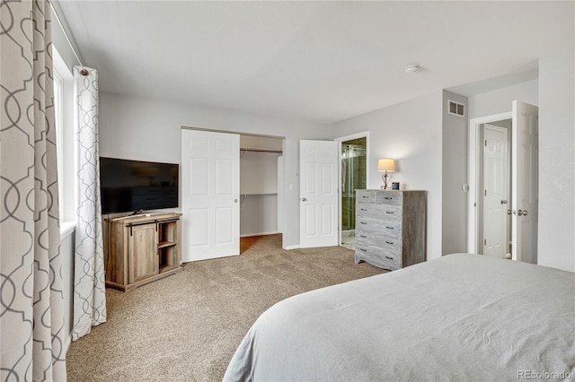 bedroom featuring carpet, a closet, visible vents, and baseboards