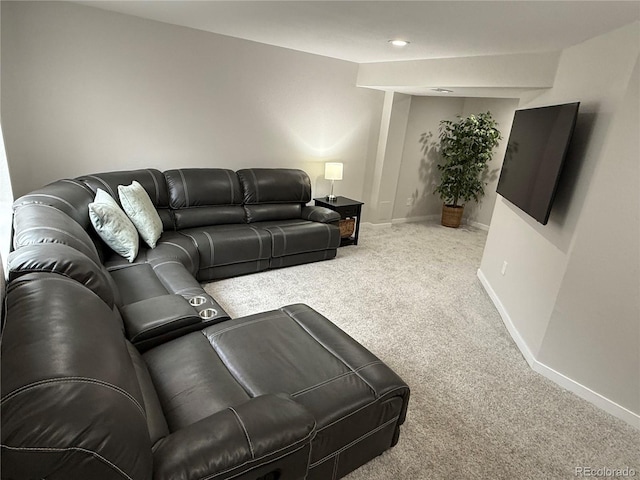 living area featuring carpet flooring and baseboards