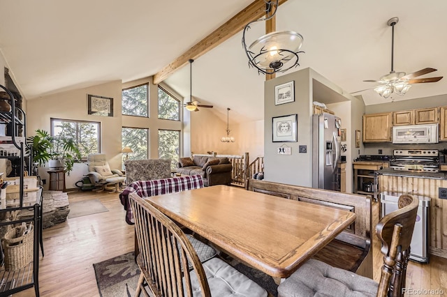 dining space featuring beamed ceiling, ceiling fan, light wood-type flooring, and high vaulted ceiling