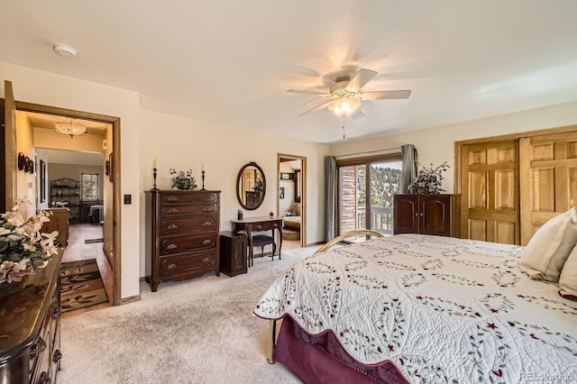 bedroom with light colored carpet and a ceiling fan