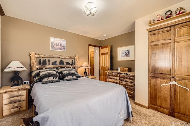 bedroom featuring light carpet