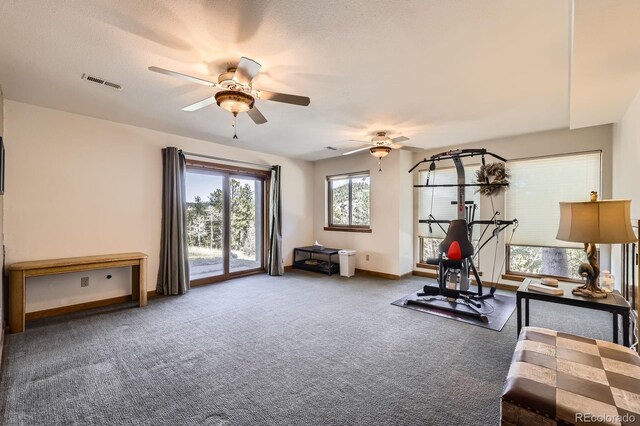 workout room featuring ceiling fan, baseboards, carpet flooring, and visible vents