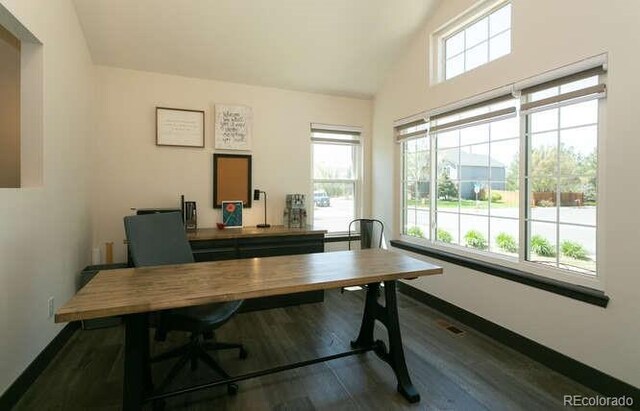 9768 Otis Dr, Westminster, CO 80021 - office with baseboards, high vaulted ceiling, and dark wood-type flooring