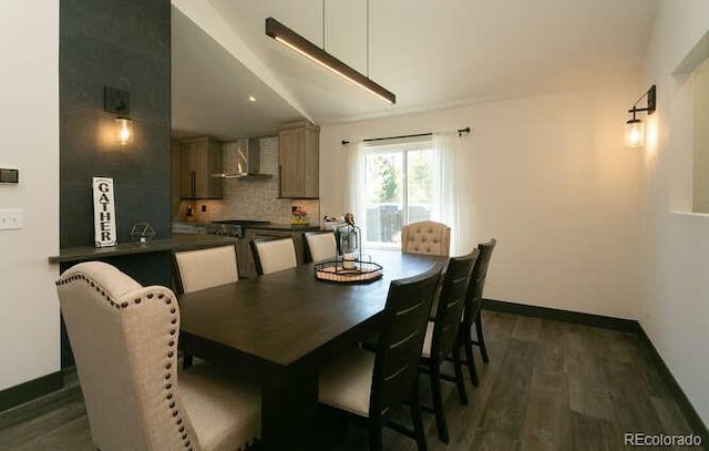 9768 Otis Dr, Westminster, CO 80021 - dining area with baseboards, vaulted ceiling, and dark wood-style flooring