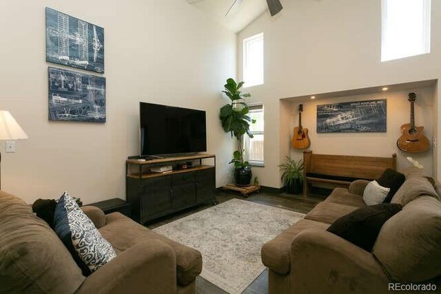 9768 Otis Dr, Westminster, CO 80021 - living room featuring high vaulted ceiling, plenty of natural light, and wood finished floors